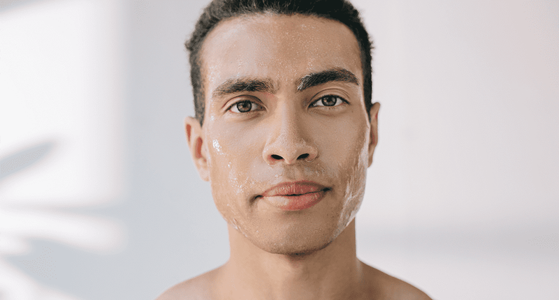 Close up of a man's face for article on dermaplaning men.