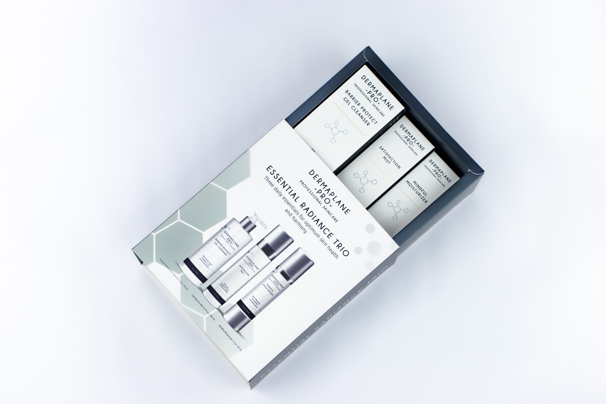 DermaplanePro Essential Radiance Trio box open to reveal three products.