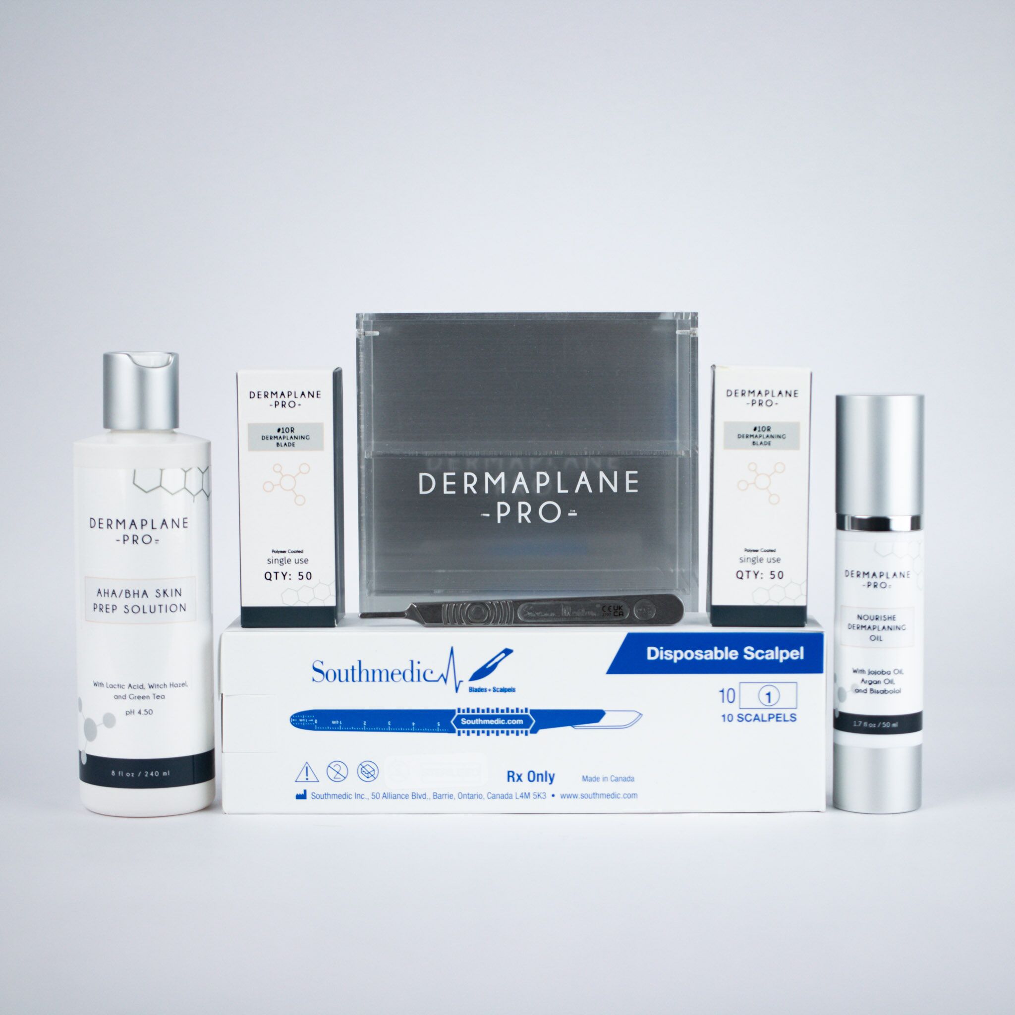 dermaplanepro-backbar-best-sellers-bundle Dermaplanepro dermaplaning backbar best sellers including AHA/BHA skin prep, Nourishe dermaplaning oil, #10R blads, #10R blades with attached handle, blade storage box, #3 metal handle, and a downloadable professional reference guide.